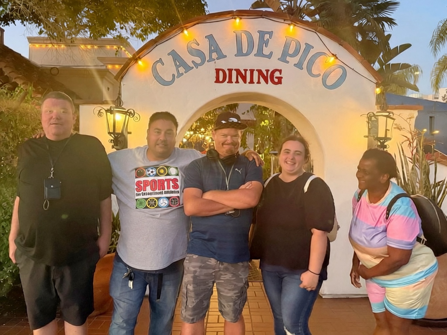 Haley and members of the Pathways Social Club family celebrating together outside Casa de Pico